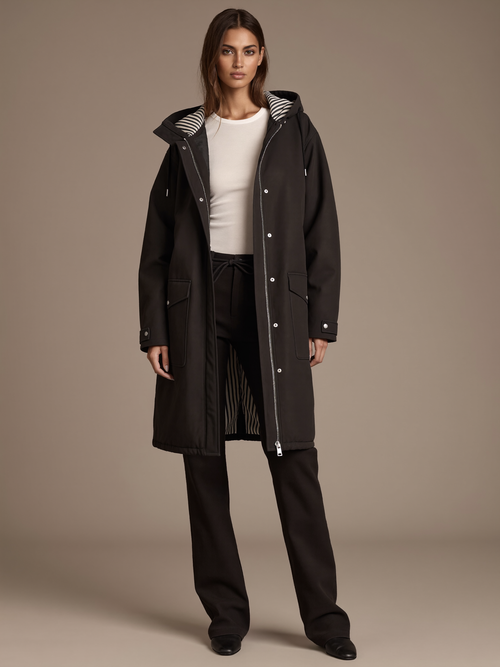 Women's Weatherproof Coat worn by model, hooded striped-lined parka, front view